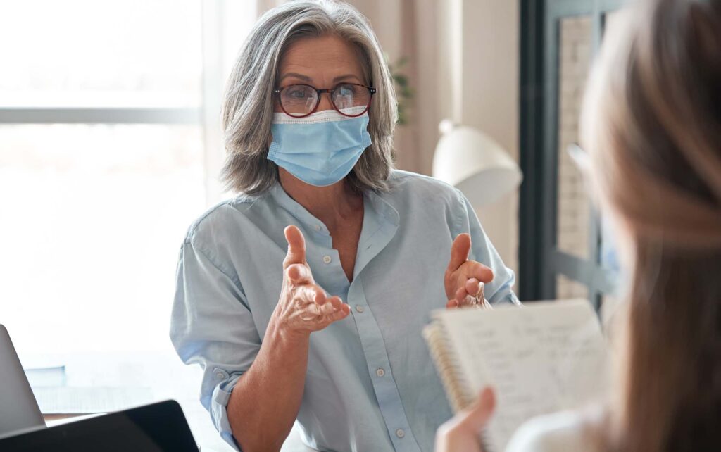 mask-in-office-two-837852285 masked staff